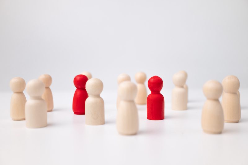 wooden figures standing out