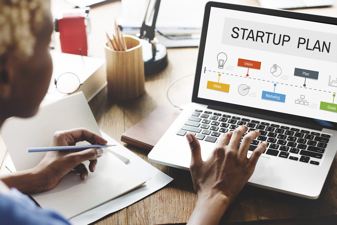 business coaching for startups with plan on screen