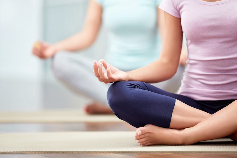 women doing yoga