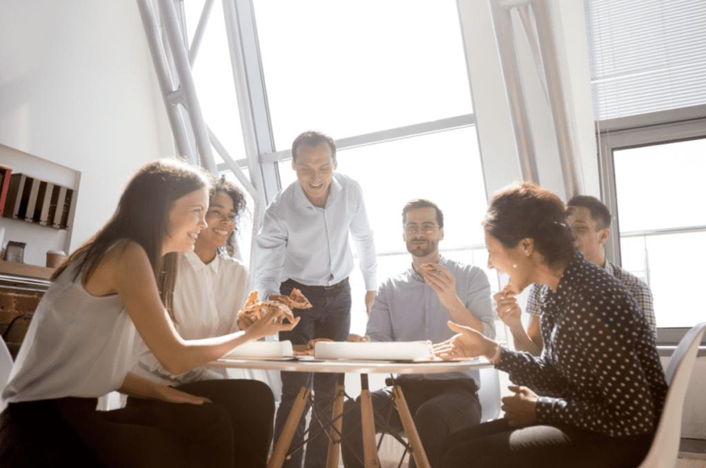 Company culture | Group of businesspeople in meeting sitting around table.