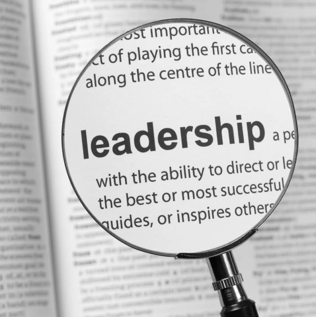 Leadership skills | Magnifying glass looking at definition of leadership.