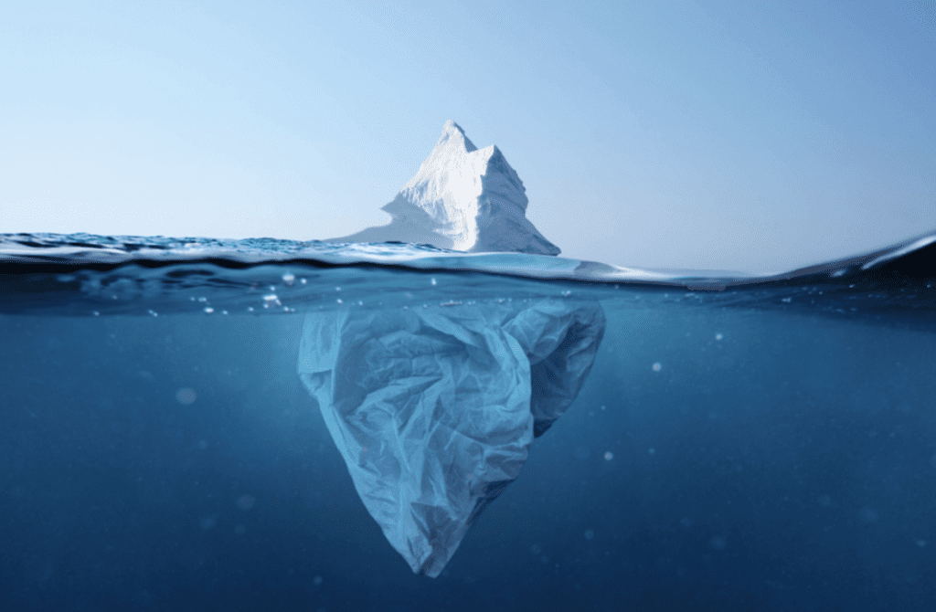 Behaviour iceberg | Iceberg floating in the sea, with the top and bottom visible underwater.