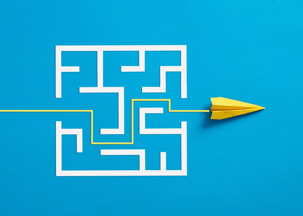Family business exit strategy | Maze with paper airplane going through