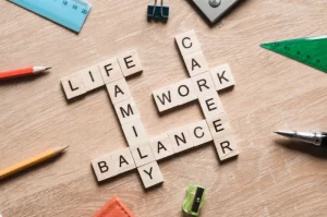 The benefits of work-life balance | Srabble wooden letters spelling out "life", "family", "balance", "career", "work".