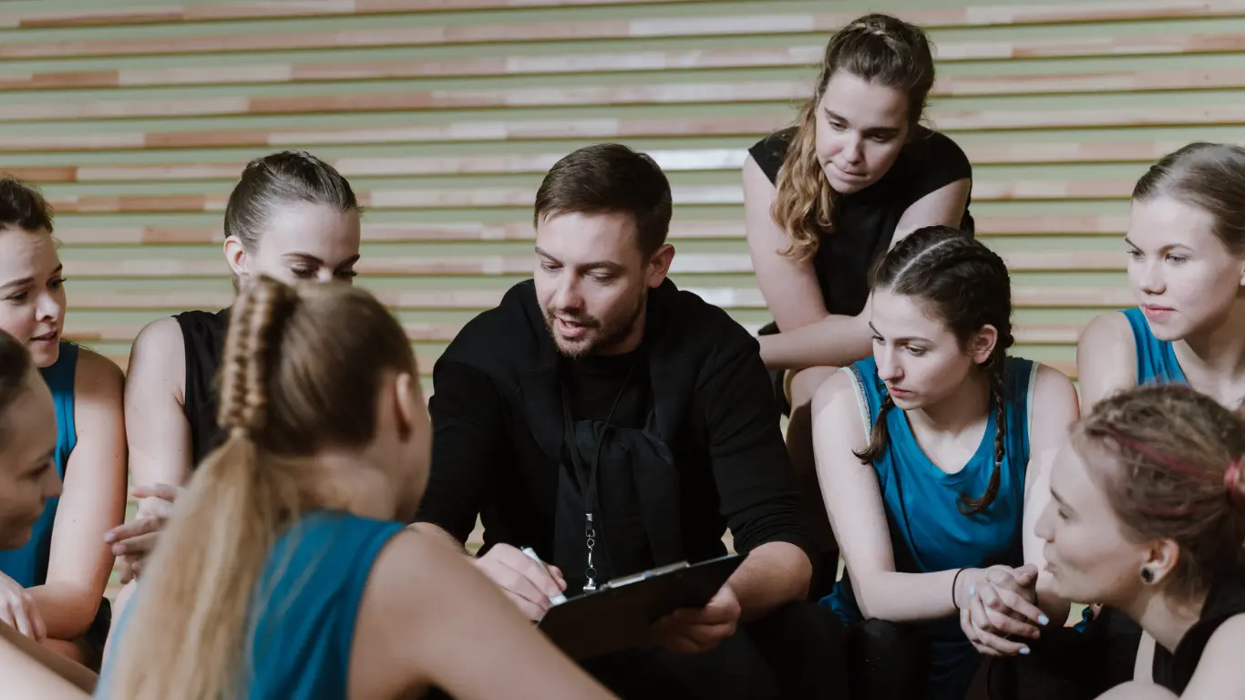 leadership development programmes showing a team around a leader