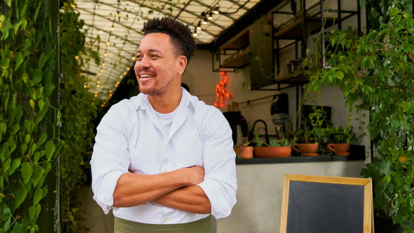 happy restaurant worker utilising business coaching services