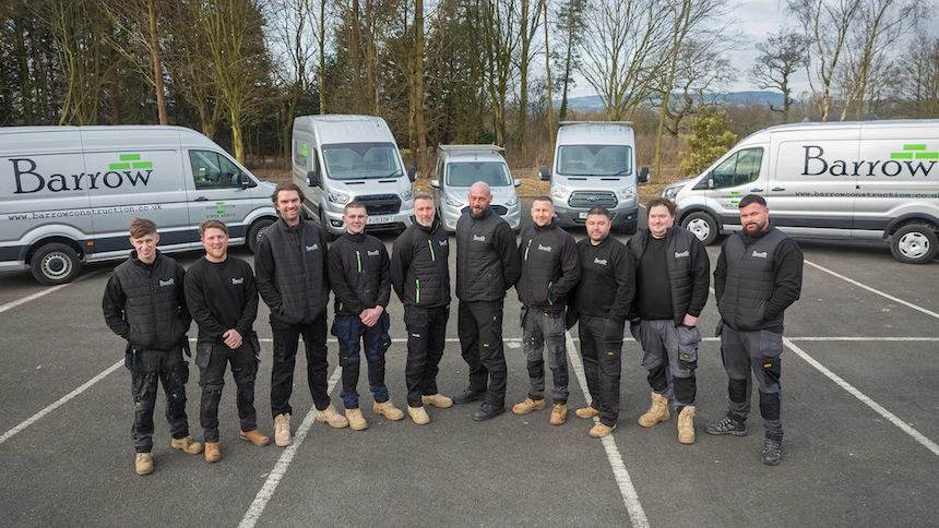 Barrow Construction business growth case study photo of team outside in front of branded vans