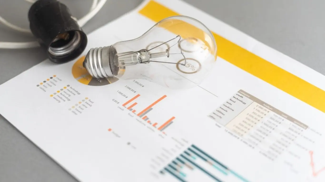 lightbulb and electricity bill demonstrating business coaching for electricians